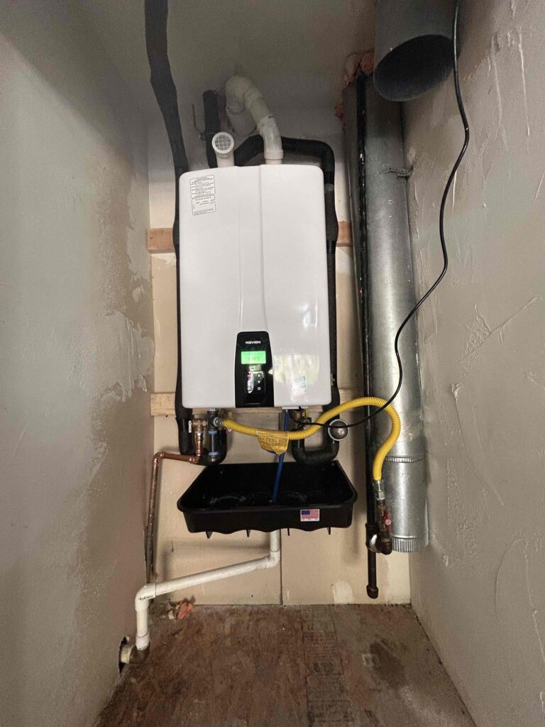 upgraded tankless water heater installed in closet