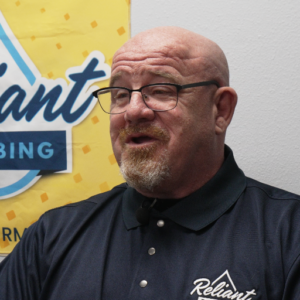 Toby Hamilton, Reliant Plumbing permit coordinator, discussing plumbing permit requirements