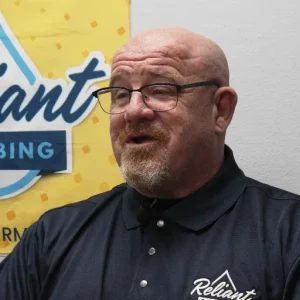 Toby Hamilton, Reliant Plumbing permit coordinator, discussing plumbing permit requirements